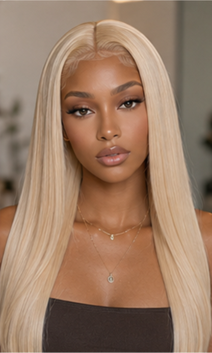 Woman with long blonde hair against a neutral background